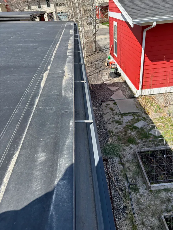 The same gutter channel, cleared and rinsed clean
